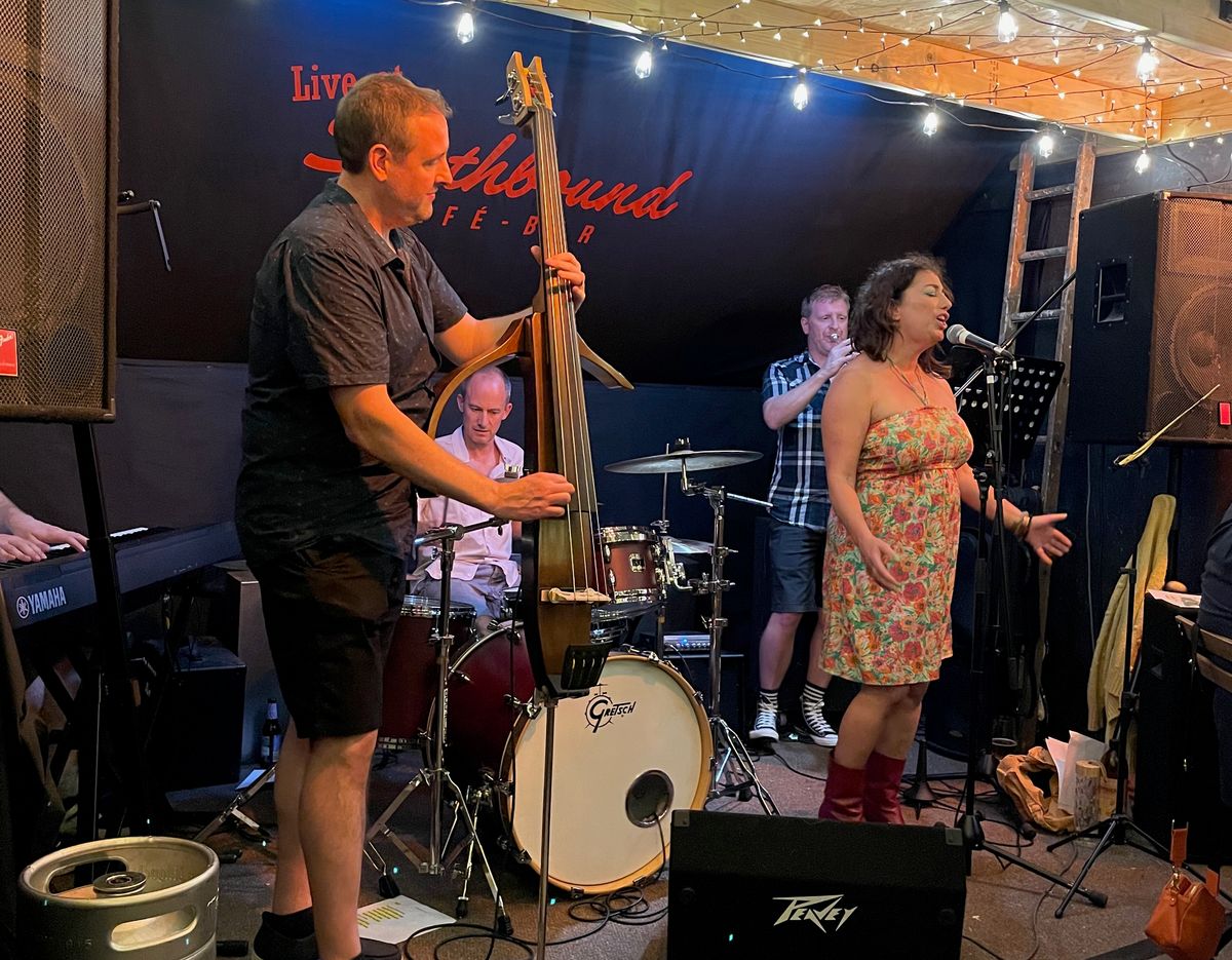 Image of the Southbound stage with a mircophone in the foreground.